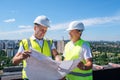 Male engineers reading blueprint together Royalty Free Stock Photo