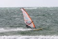 Male enjoying Windsurfing sail in Varamon Motala sea waves
