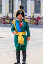 Male entertainer in period outfit awaiting tourists for photo opportunities near Palace Square in Saint Petersburg, Russia