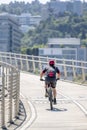 Male enthusiast rides a bicycle on a bike path at Tilikum Crossing Bridge