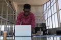 Male executive using laptop in office Royalty Free Stock Photo