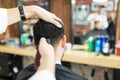 Male Expert Using Trimmer Machine On Client`s Hair