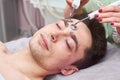 Male face, microcurrent treatment.