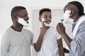 Male Family Traditions. Father And Grandfather Teaching Black Preteen Boy Shaving