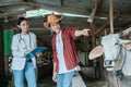 a male farmer with a finger pointing while with a female vet Royalty Free Stock Photo