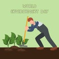 Male farmer planting young seedlings plants vegetables. man working in garden. Royalty Free Stock Photo