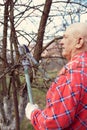Male farmer pruning tree branches Royalty Free Stock Photo