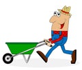 Male farmer pushing a cart