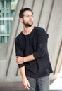 Male fashion model with beard posing outdoors Royalty Free Stock Photo