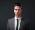 Male fashion model in gray suit and tie Royalty Free Stock Photo