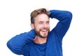 Male fashion model laughing with hand in hair