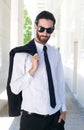 Male fashion model in shirt and tie posing outside