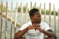 Male fashion model sitting outdoors Royalty Free Stock Photo