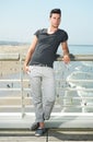 Male fashion model standing at beach