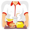 Male fast food restaurant employee holding tray with common fast food snacks Royalty Free Stock Photo