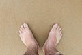 Male feet beach sand holiday middle aged wet vacation Royalty Free Stock Photo