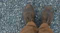 Male feet in leather brown shoes and mustard trousers Royalty Free Stock Photo