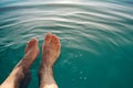 Male feet in outdoor swimming pool Royalty Free Stock Photo