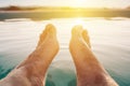 Male feet in outdoor swimming pool Royalty Free Stock Photo