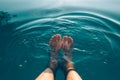 Male feet in outdoor swimming pool Royalty Free Stock Photo