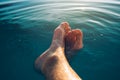 Male feet in outdoor swimming pool Royalty Free Stock Photo