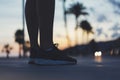 Male feet with sneakers close up on background sunset or sunrise nature outdoor, sports man running marathon, workout style Royalty Free Stock Photo