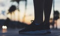 Male feet with sneakers close up on background sunset or sunrise nature outdoor, sports man running marathon, workout style Royalty Free Stock Photo