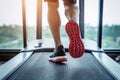 Male feet in sneakers running on the treadmill at the gym. Exercise concept Royalty Free Stock Photo