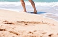Male feet step on the sea wave. Summer vacations concept.Beach holiday Royalty Free Stock Photo