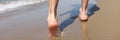 Male feet walking on sand at beach closeup Royalty Free Stock Photo