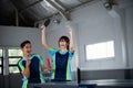 male and female asian ping pong players happy to score Royalty Free Stock Photo