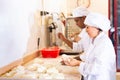 Male and female baker working together in bakery Royalty Free Stock Photo