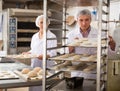 Male and female baker working together in bakery shop Royalty Free Stock Photo