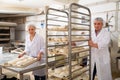 Male and female baker working together in bakery shop Royalty Free Stock Photo