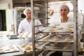 Male and female baker working together in bakery shop Royalty Free Stock Photo