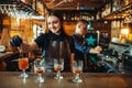 Male and female bartender at the bar counter Royalty Free Stock Photo