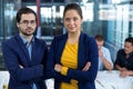 Male and female business executive standing with arms crossed Royalty Free Stock Photo