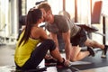 Male and female with close face in gym