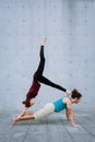 Couple practicing acro yoga outdoors. Acroyoga concept.