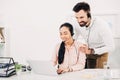 Male and female coworkers looking at laptop Royalty Free Stock Photo