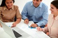 Male and female coworkers working on documents Royalty Free Stock Photo