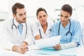 Male and female doctors working on reports Royalty Free Stock Photo