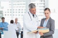 Male and female doctors working on reports Royalty Free Stock Photo