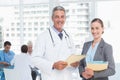 Male and female doctors working on reports Royalty Free Stock Photo