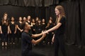 Male And Female Drama Students At Performing Arts School In Studio Improvisation Class Royalty Free Stock Photo