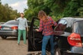 Male and female drivers after car accident on road Royalty Free Stock Photo