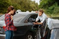 Male and female drivers on road, car accident Royalty Free Stock Photo