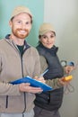 male and female electricians working together Royalty Free Stock Photo