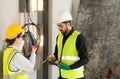 Male and female engineers working on construction site, Royalty Free Stock Photo