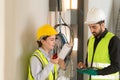 Male and female engineers working on construction site Royalty Free Stock Photo
